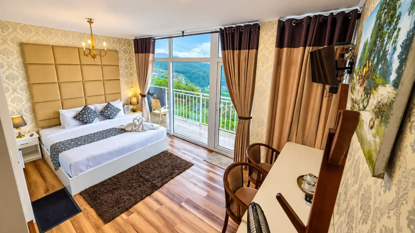 Deluxe balcony room opening towards the hillside
