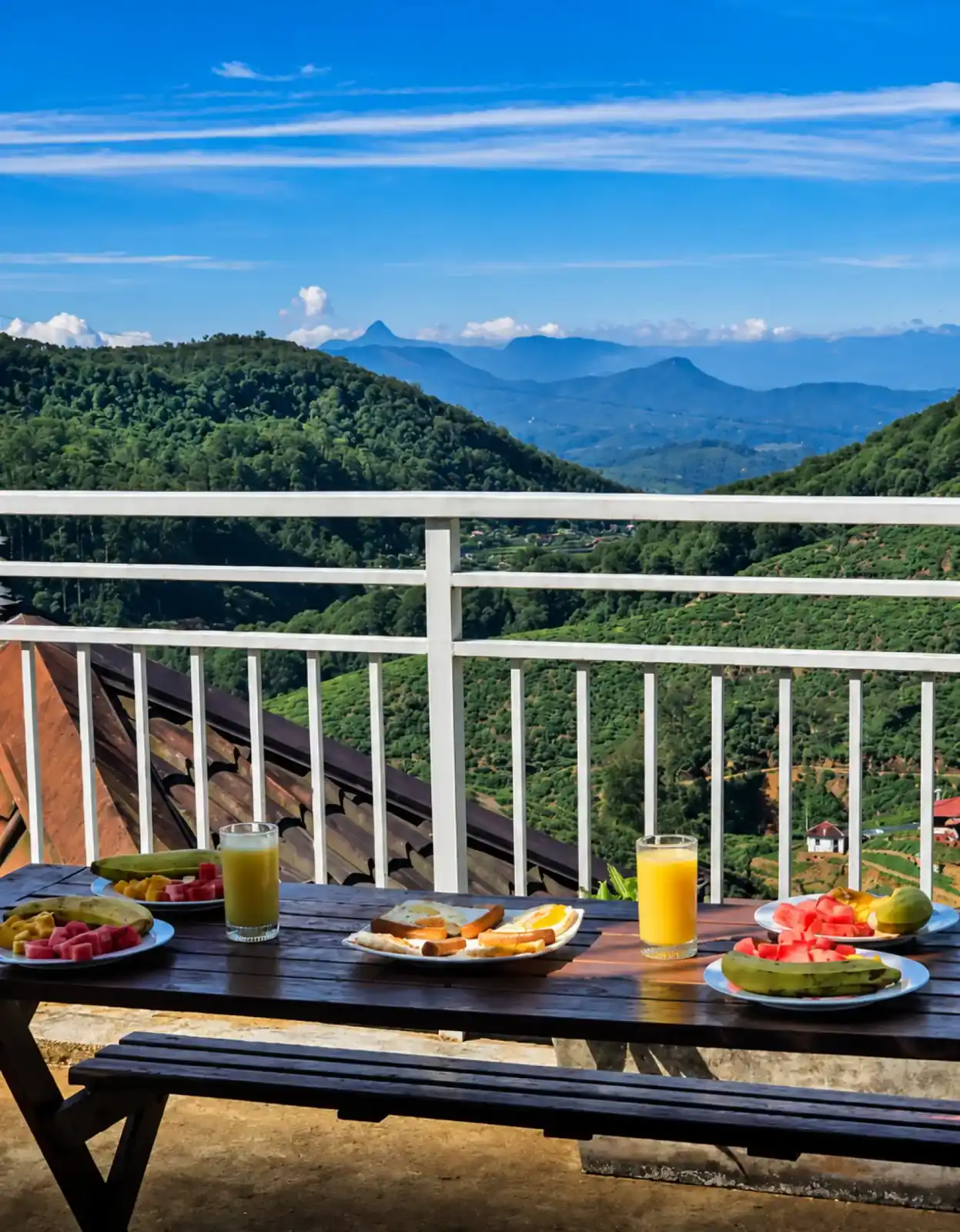 Breakfast laid out on a terrace overlooking the tea country