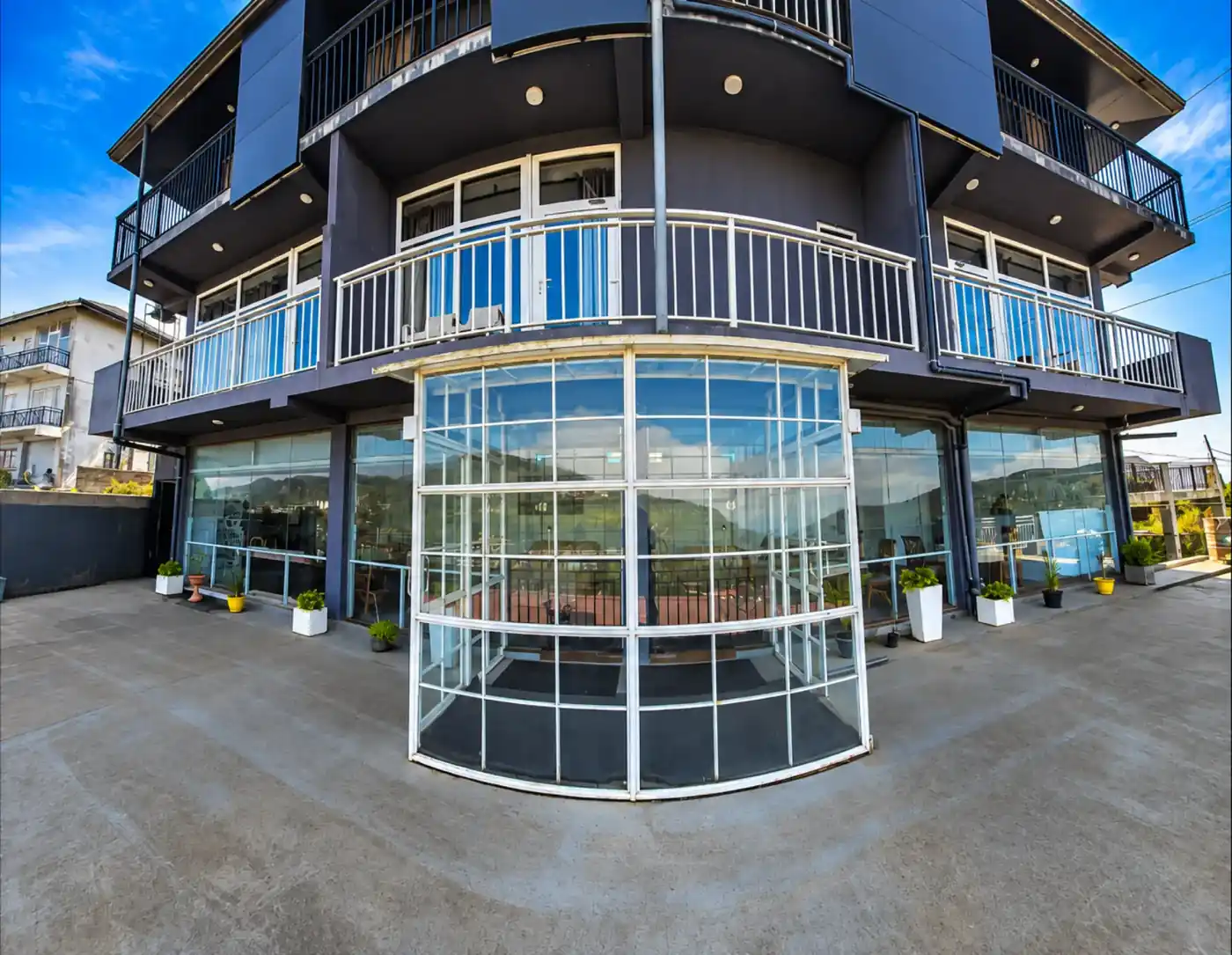 Hotel Bonavista exterior and glass-fronted entrance in Nuwara Eliya