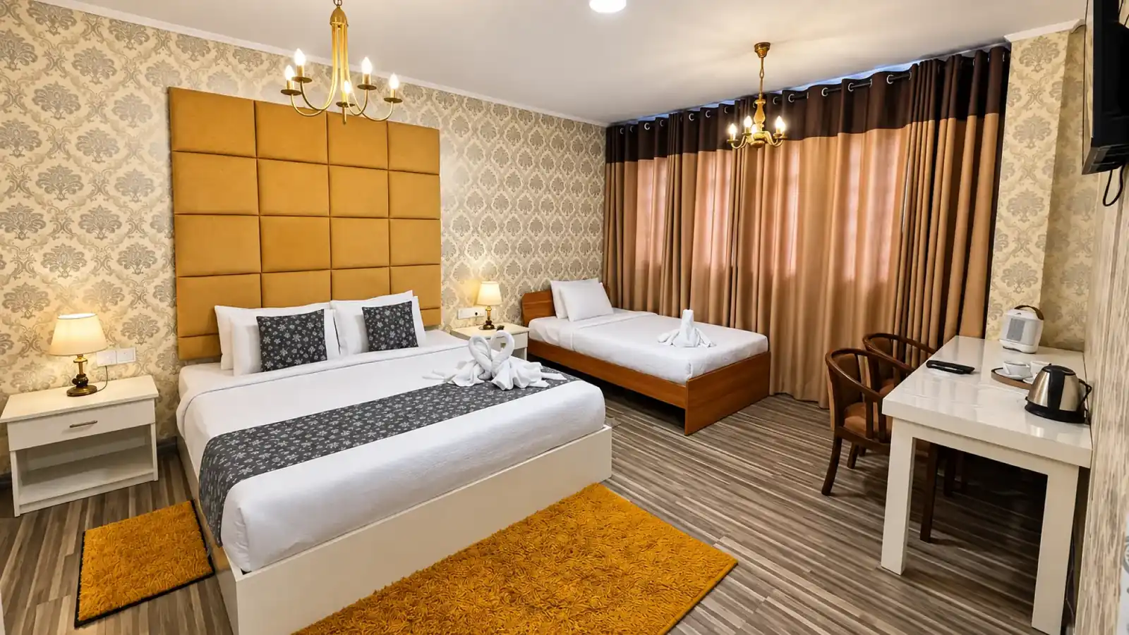 Wide view across a triple room towards the windows